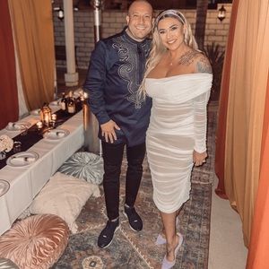 White one shoulder long sleeved dress. Wore for a party 1 time.Dry cleaned after